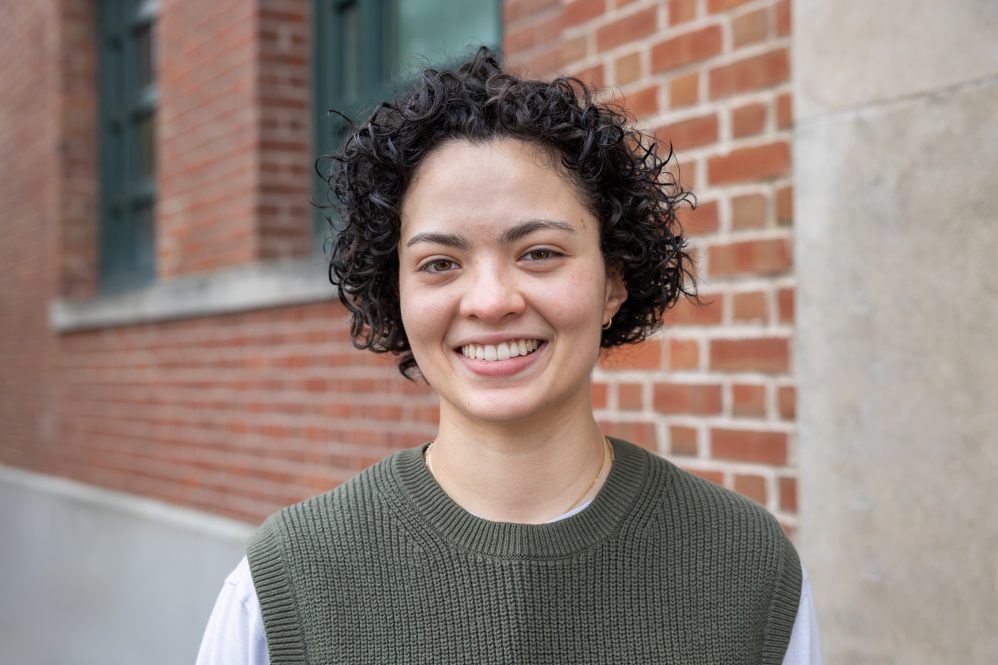 Gabriela Fonseca '24 poses for a photo outside Young Building