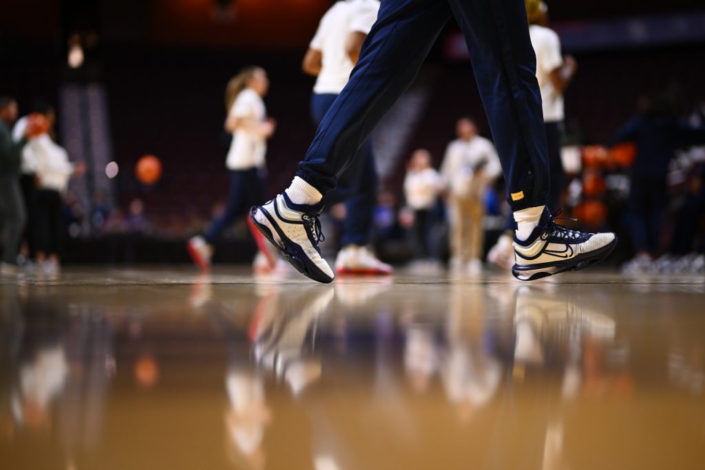 Close up of a women's basketball player's shoes on the court
