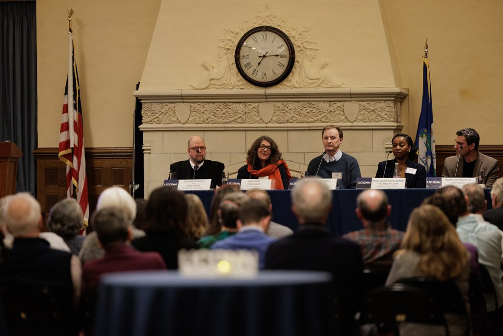 Panelists sit at a table during the first installment of the UConn Impact series.