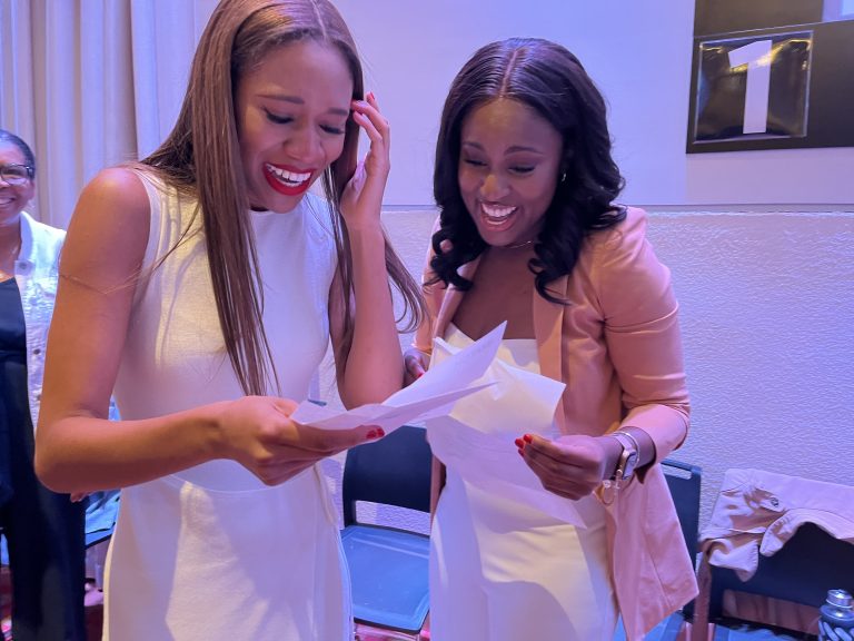 Jasmin Williams and Abigail Boursiquot reading their Match Day letters together.