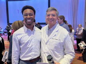 Timothy Mason '24 MD celebrating Match Day with Professor of Medicine Dr. Steven Angus.