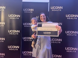 Emma Mastrobattista '24 MD was assisted by her son Leo in celebrating her match to residency in Connecticut at The Institute of Living at Hartford Hospital.
