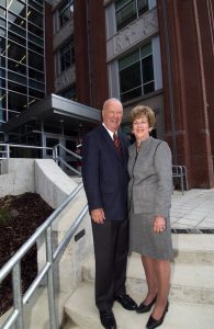 Ray and Carole Neag stand on the steps of the Gentry Building in 2004.