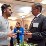 Dean Chaubey (right) speaks with Sandeep Paudel, recipient of the MS Graduate Student Research and Creativity Award