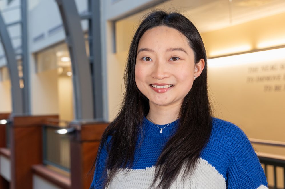 Krystal Zhao '24 poses for a photo in Gentry Building