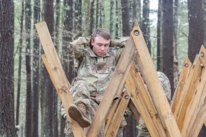 UConn Army ROTC cadet Paul Kass goes through one of the obstacles during an exercise on the second day of the Combined Field Training Exercise (CFTX) at Fort Devens.