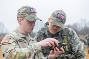 UConn Army ROTC Cadets Jackson Bright (left) and Geoffrey Takacs (right) look at the schedule for the first day of the Combined Field Training Exercise (CFTX) at Fort Devens.