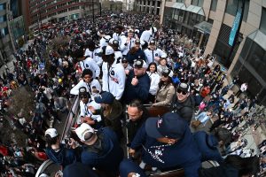 The UConn men's basketball team in the top of a double-decker bus in Hartford.