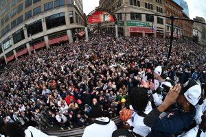 A huge crowd of fans lines the streets of Hartford for the victory parade.