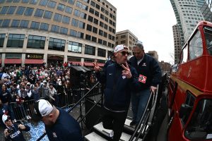 Coach Dan Hurley steps down the stairs from the podium at the the victory rally.