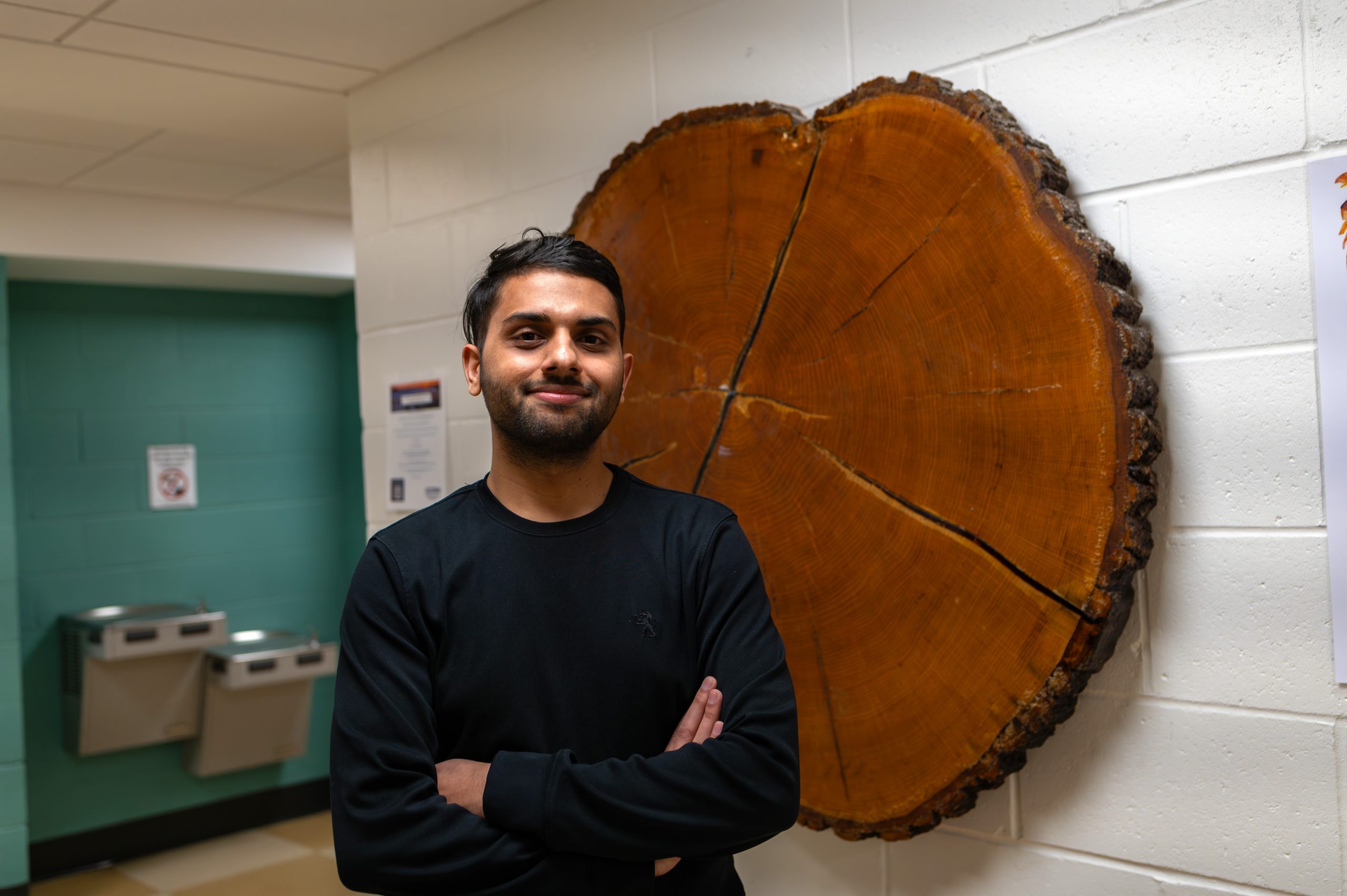 Sandeep Poudel MS '24 (CAHNR) in the Young building. (Nick Snow/UConn Photo)