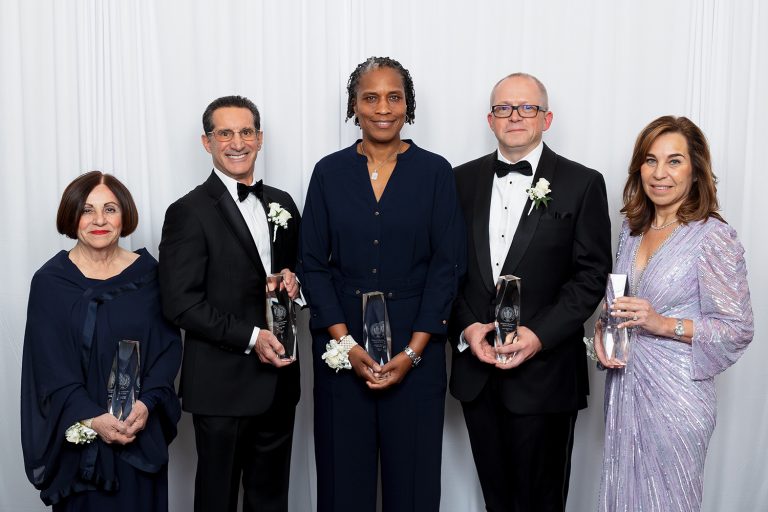 The Hall of Fame 2024 Inductees: Left to right: Antonietta “Toni’’ Boucher ’02 MBA, Randy Siller ’79, Jamelle Elliott ’96, ’97 MA, Lee McChesney ’94, and Mary Jane Fortin ’86