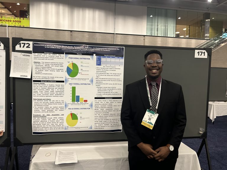 UConn School of Medicine student Ire Opayemi presenting his winning research poster at the American College of Physicians national Internal Medicine Meeting.