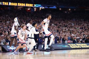 The UConn Huskies celebrate as the national championship game ends in Arizona.