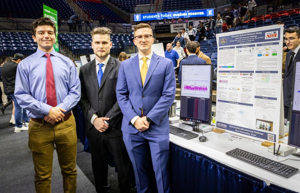 Electrical and computer engineering majors Matthew Silverman ’24, Spencer Albano ’24, and Nicholas Wycoff ’24 stand by their research poster.