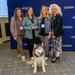 Carey Jordan, left, Hayley Jacobs, and Lara Smith, members of the Center for Students with Disabilities accommodations team, receive the Team award from President Radenka Maric during the Spirit Awards ceremony.