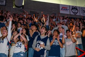 UConn students cheering on the Huskies from the watch party at Gampel Pavilion.