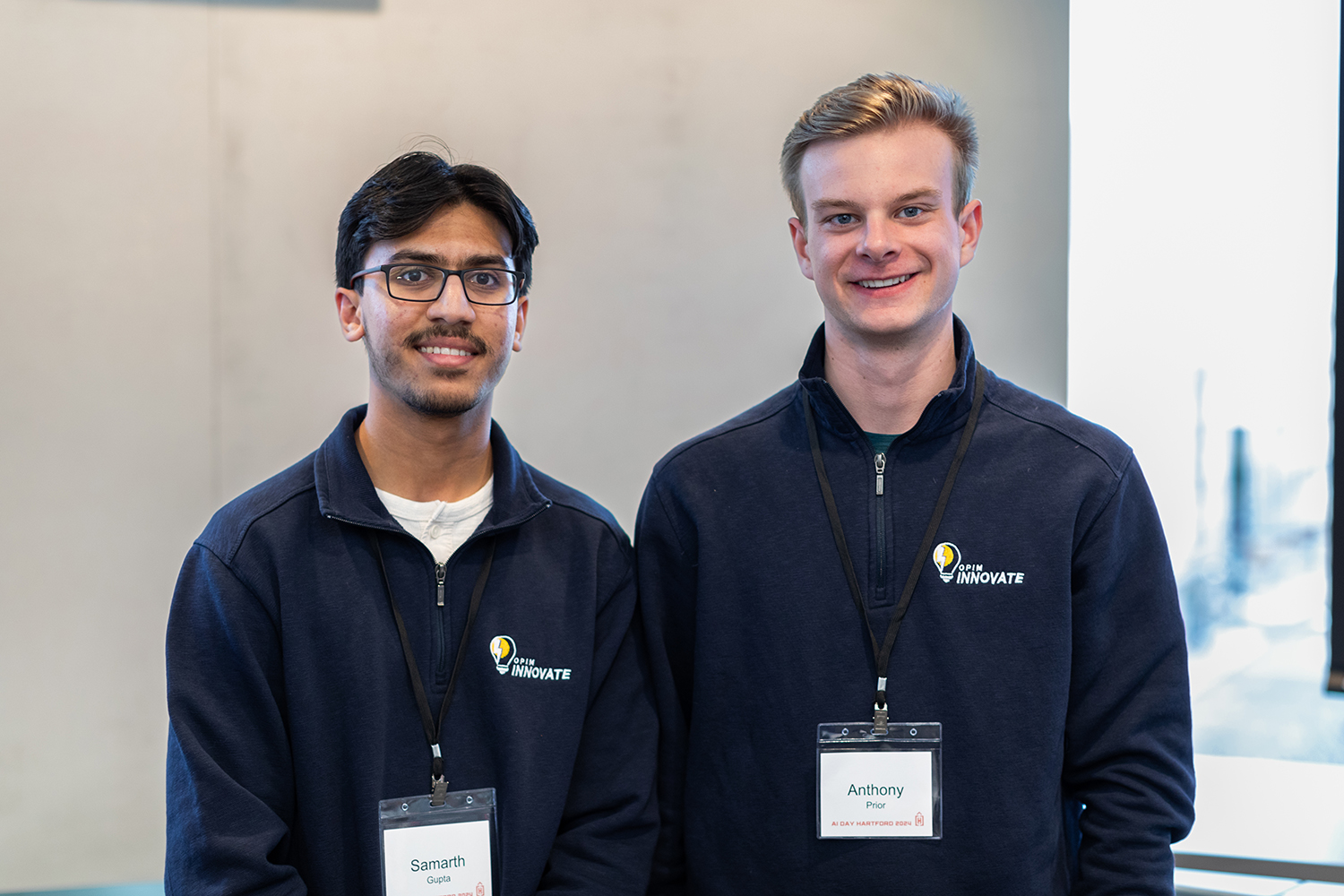 Samarth Gupta '26, left, and Anthony Prior '26, right, during Hartford AI Day at the Graduate Business Learning Center in Hartford (Garrett Uhde, Defining Studios)
