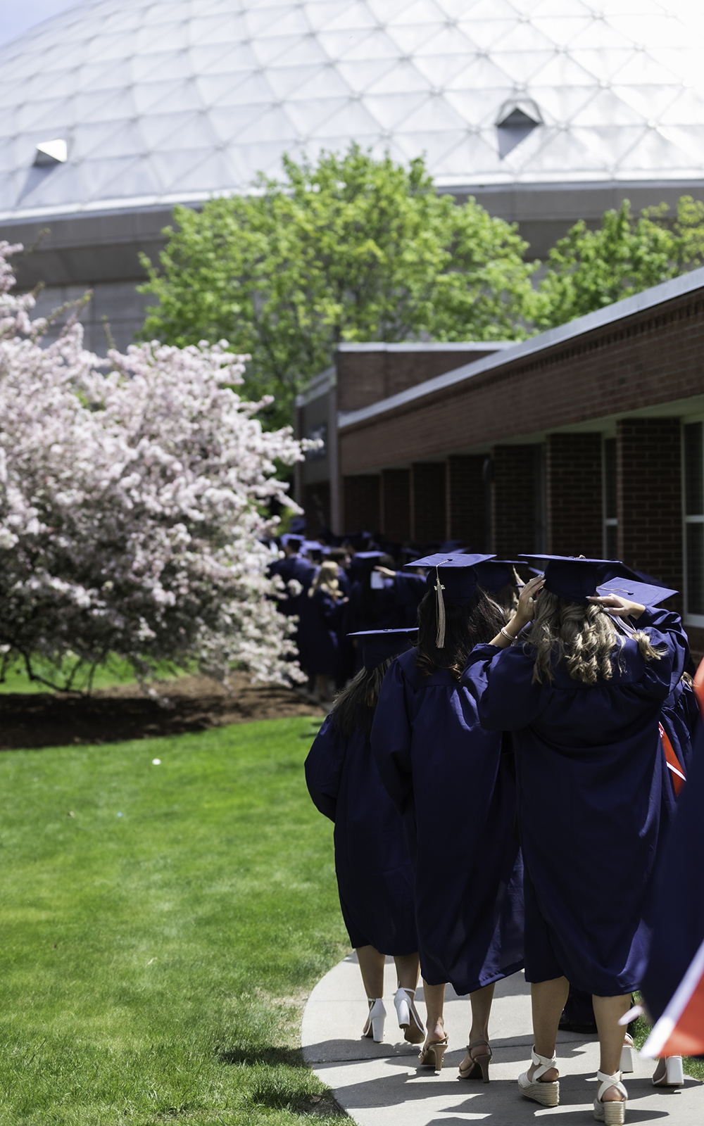 School of Business students lining up outside Gampel Pavilion in Storrs, CT during Commencement 2024. (Nathan Oldham / UConn School of Business)