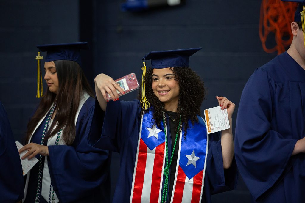 Student takes a selfie before commencement ceremony.
