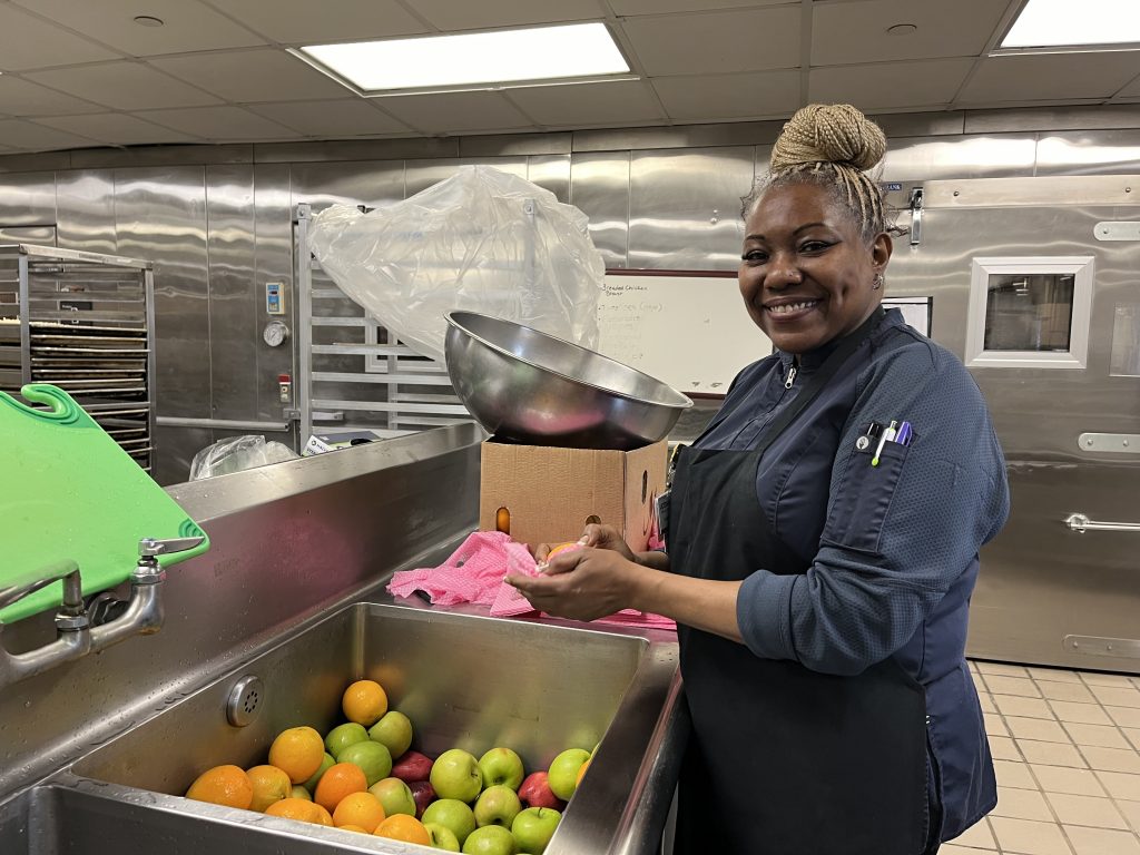 UConn Health Catering Cook JuJu Morrison, originally from Jamaica and who resides in East Hartford, joined UConn Health in 2023.