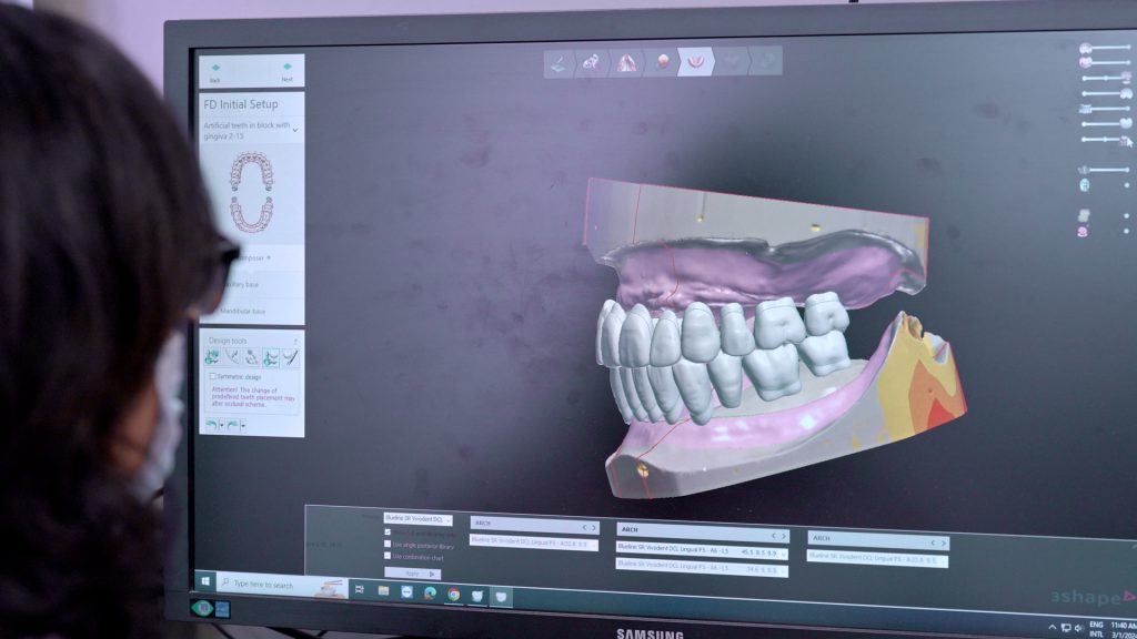 Student studying dentures online