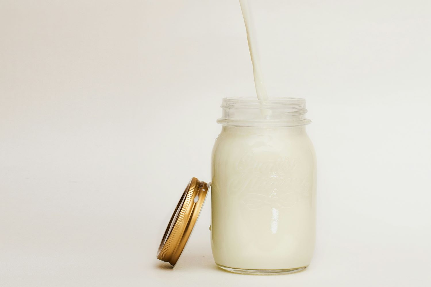 Milk pour into a mason jar