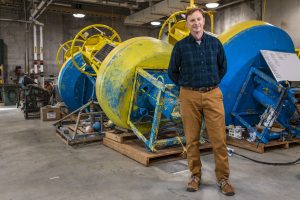 CIRCA director and marine sciences professor James O'Donnell stands in front of submarine equipment at UConn Avery Point