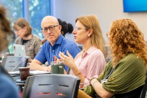 Participants of the Summer Seminar for Genocide Studies and Prevention engage in discussion during a session