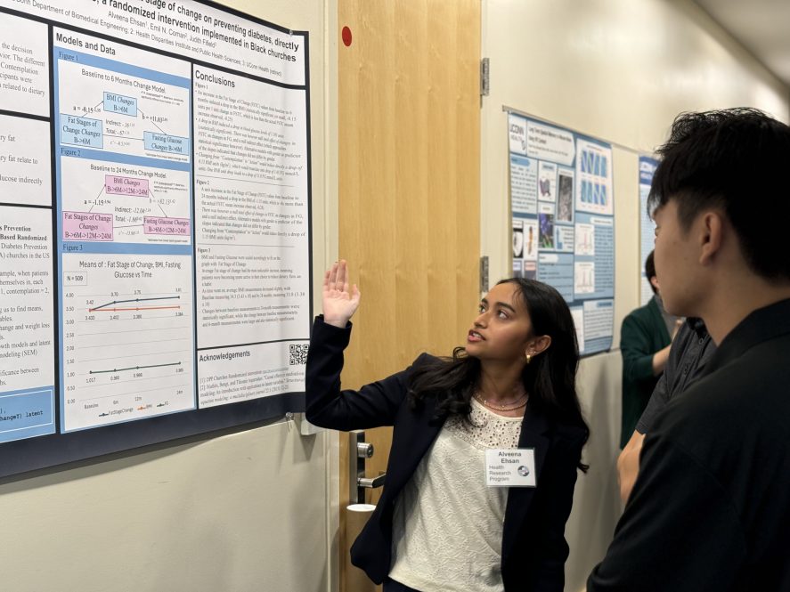 Rising sophomore and Health Research Program participant Alveena Ehsan shares her research during the poster session.