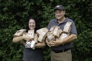 The Cecchinis pose with some of the products they make.