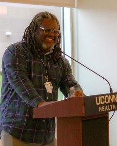 Andre Rochester at UConn Health podium