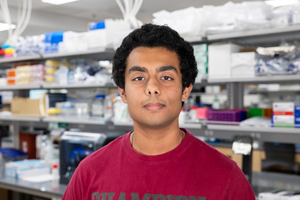 Varun Chamarty ’26 (ENG) poses for a photo in a lab in the Academic Building of the UConn Health campus