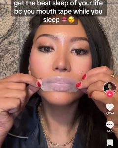 screen grab of TikTok post of women taping her lips