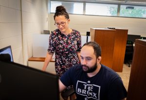 Anna Tarakanova and Mohammad Madani studying proteins.