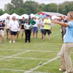 Graduate student Tessa Hospod in the Department of Plant Science and Landscape Architecture, speaks with attendees of the 2024 Turfgrass Field Day. (Jason Sheldon/UConn Photo)