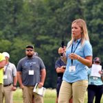 Graduate student Tessa Hospod in the Department of Plant Science and Landscape Architecture, speaks with attendees of the 2024 Turfgrass Field Day. (Jason Sheldon/UConn Photo)