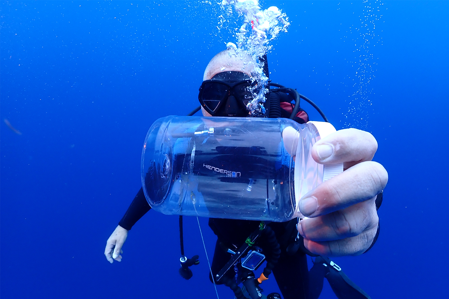 Godfrey gathering samples of organisms while on a blue water dive.