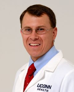 Dr. Timothy Lishnak portrait white coat