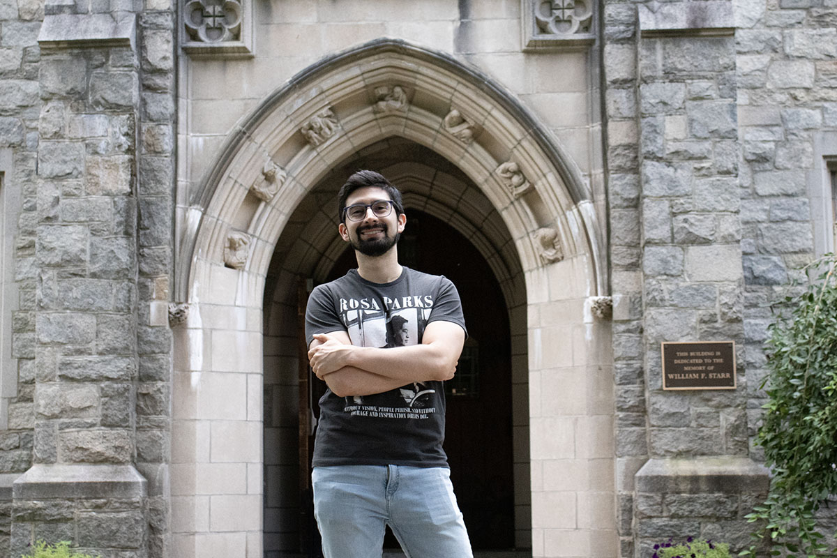 Luis Eduardo Salazar stands in front of Starr Hall.