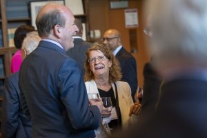 Kathleen Segerson, Board of Trustees Distinguished Professor and NAS member, talking with attendees at the UConn National Academy of Sciences Celebration at the UConn School of Law.