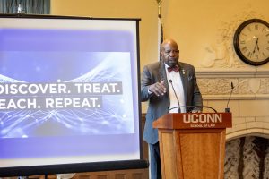 Cato T. Laurencin, M.D., Ph.D. Albert and Wilda Van Dusen Distinguished Professor of Orthopaedic Surgery speaking at the Uconn National Academy of Sciences Celebration at UConn School of Law.