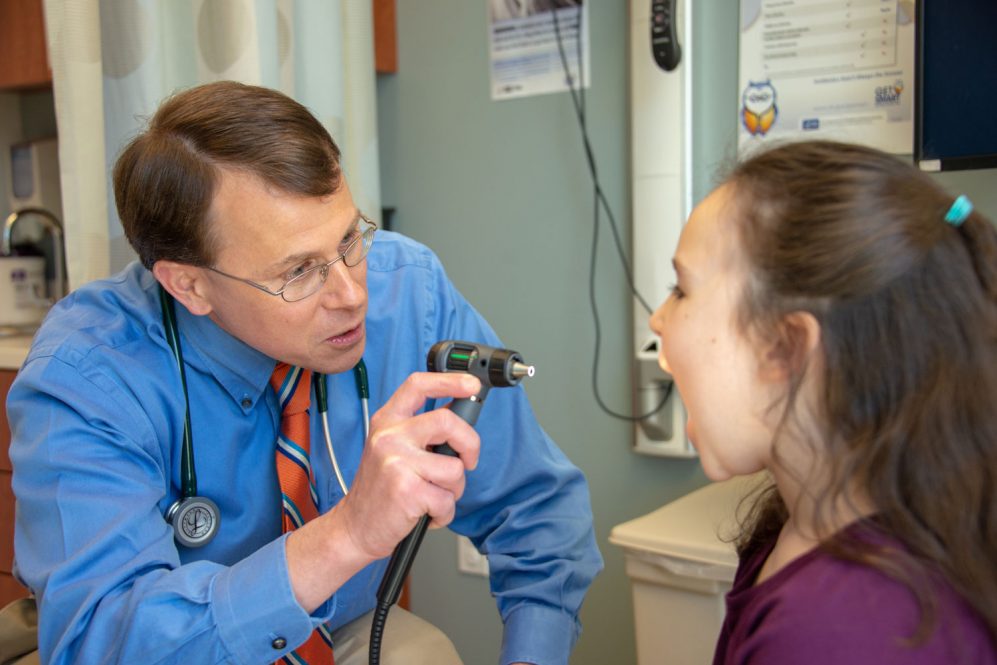 Dr. Timothy Lishnak examines a model patient