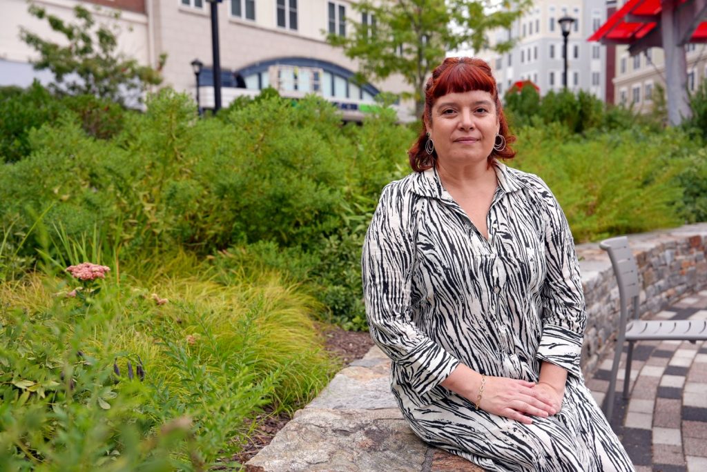 Woman sitting near plants