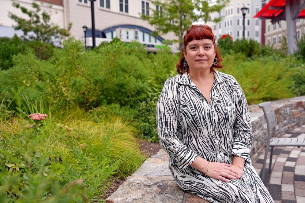 Woman sitting near plants