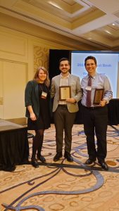 Co-authors Sercan Canbolat '17 MA '23 Ph.D. (center) and Özgür Özdamar, professor of international relations at Bilkent University in Ankara, Turkey, (right) -- with Danielle Lupton, associate professor of political science at Colgate University (left) -- accept the 2024 ISA Best Book in Foreign Policy Analysis Award at the ISA 2024 Annual Convention in San Francisco.