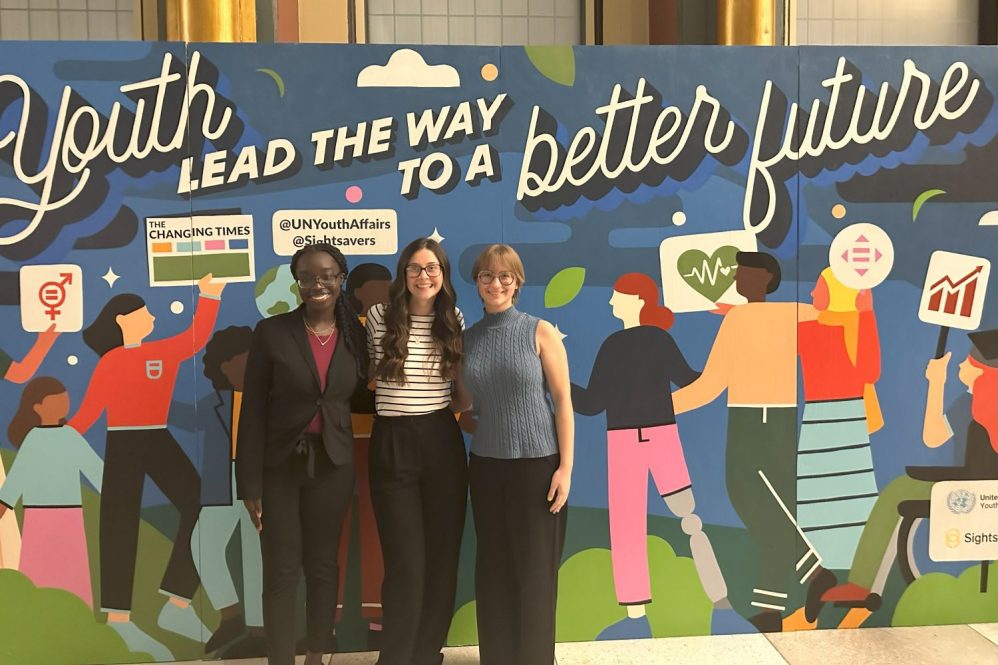 The students pose near UN sign