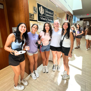 Five freshmen from the School of Nursing posing for an Instagram post during Weekend of Welcome