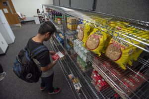 A student shopping at Husky Harvest Food Pantry at UConn Stamford