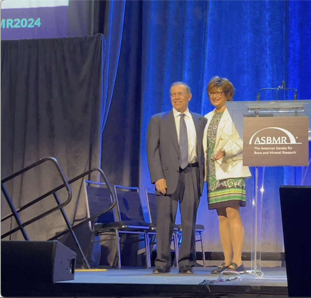 Dr. Andrew Arnold accepting the highest honor of ASBMR from its President Laura Calvi, MD.